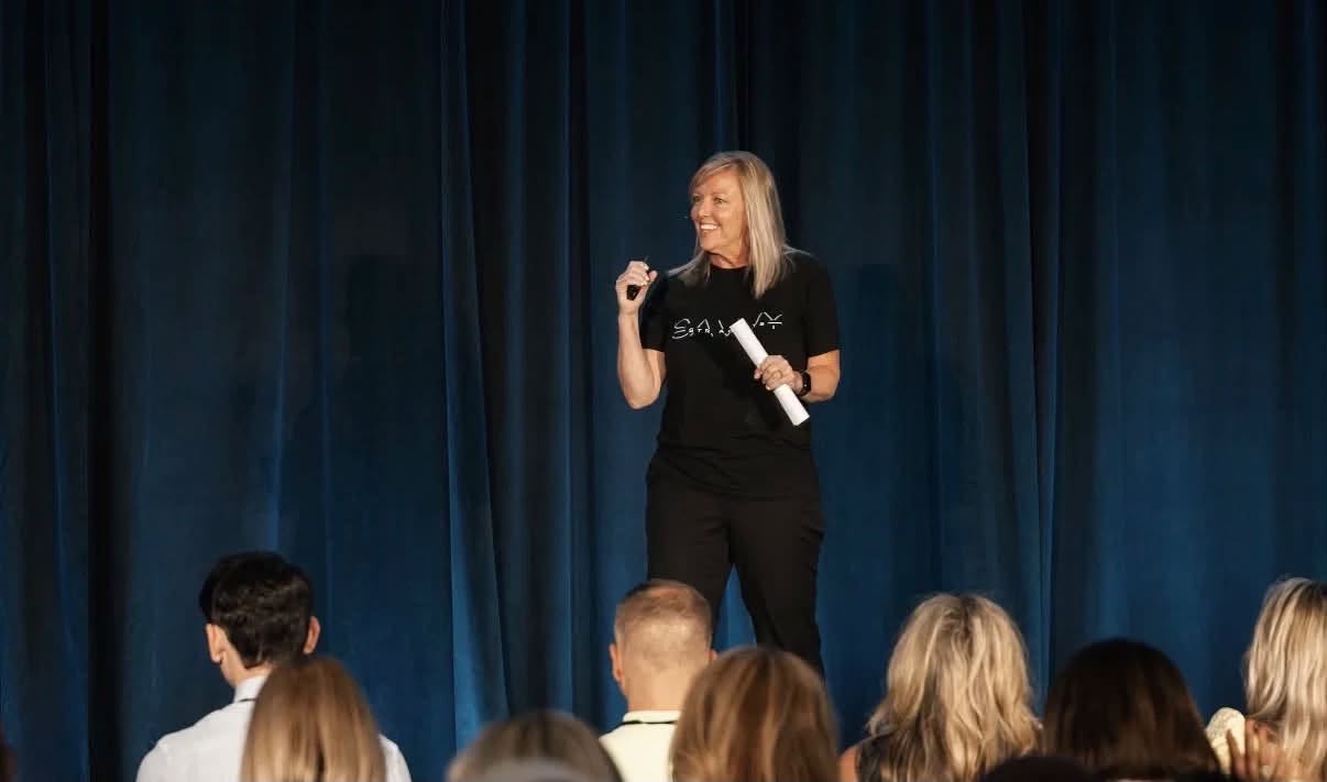 Speaking on stage at a Savvy event