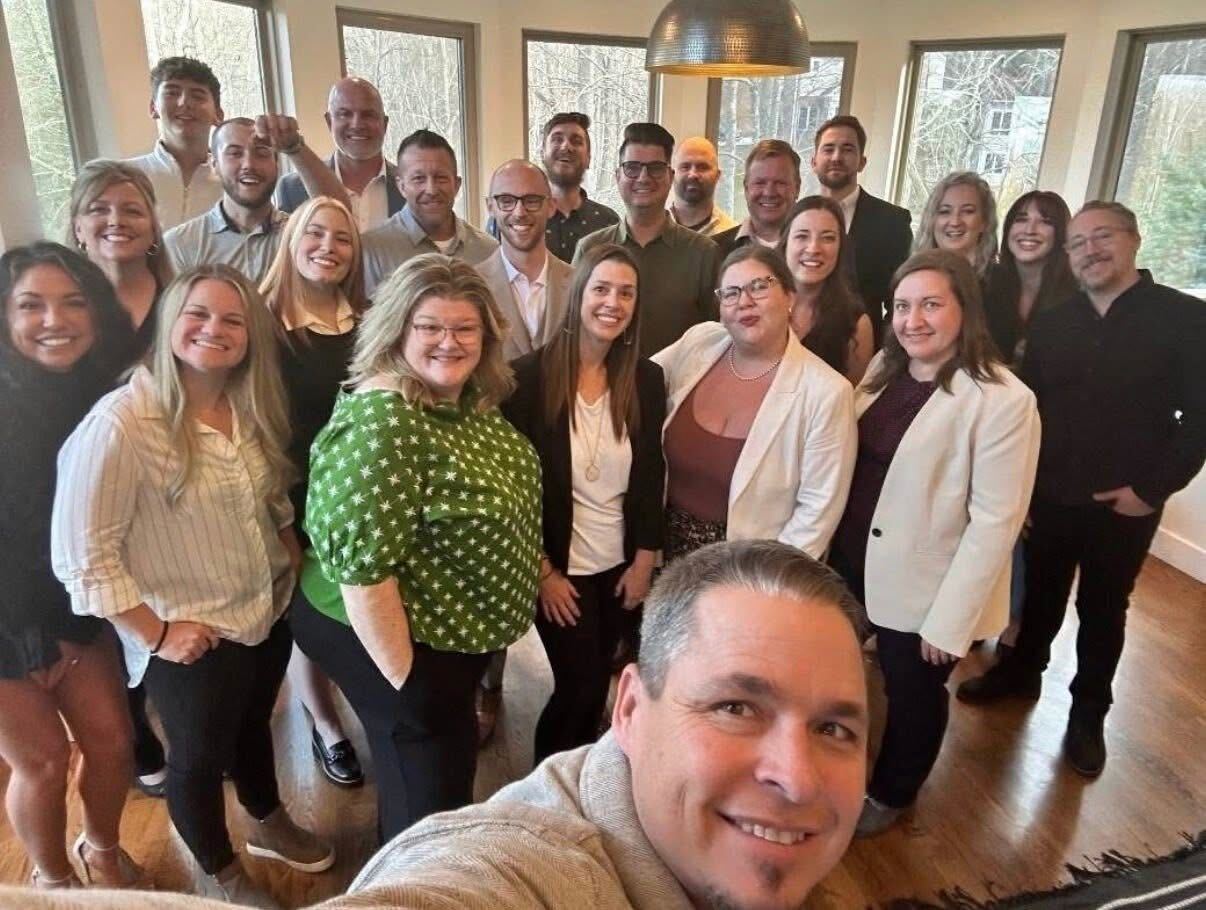 The full Savvy STR Agents team gathered at a team retreat